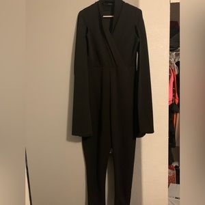 Black cape detailed jumpsuit